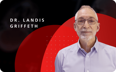 Dr. Landis Griffeth | Older man wearing glasses and a button up shirt. 